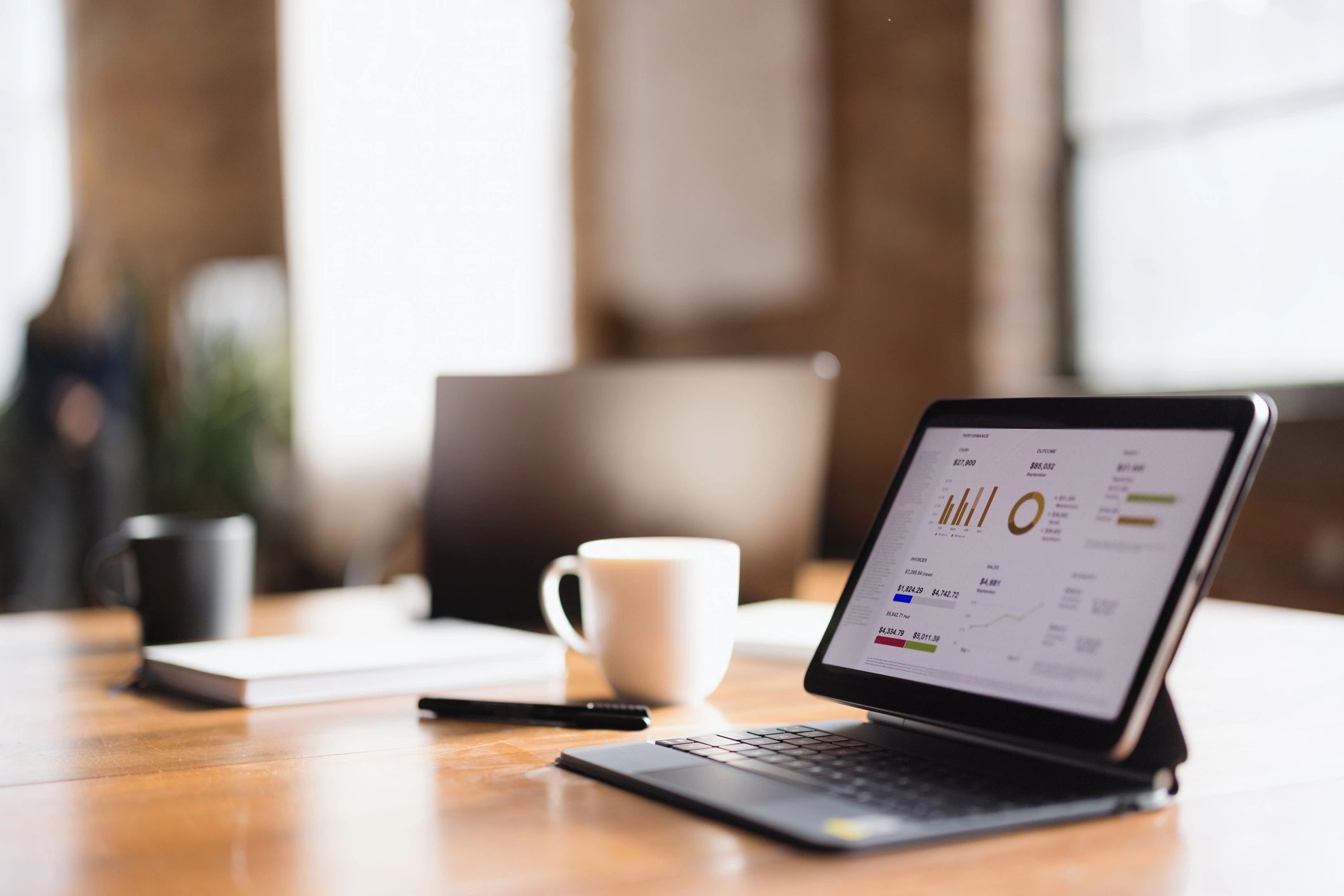 Business performance charts on a tablet